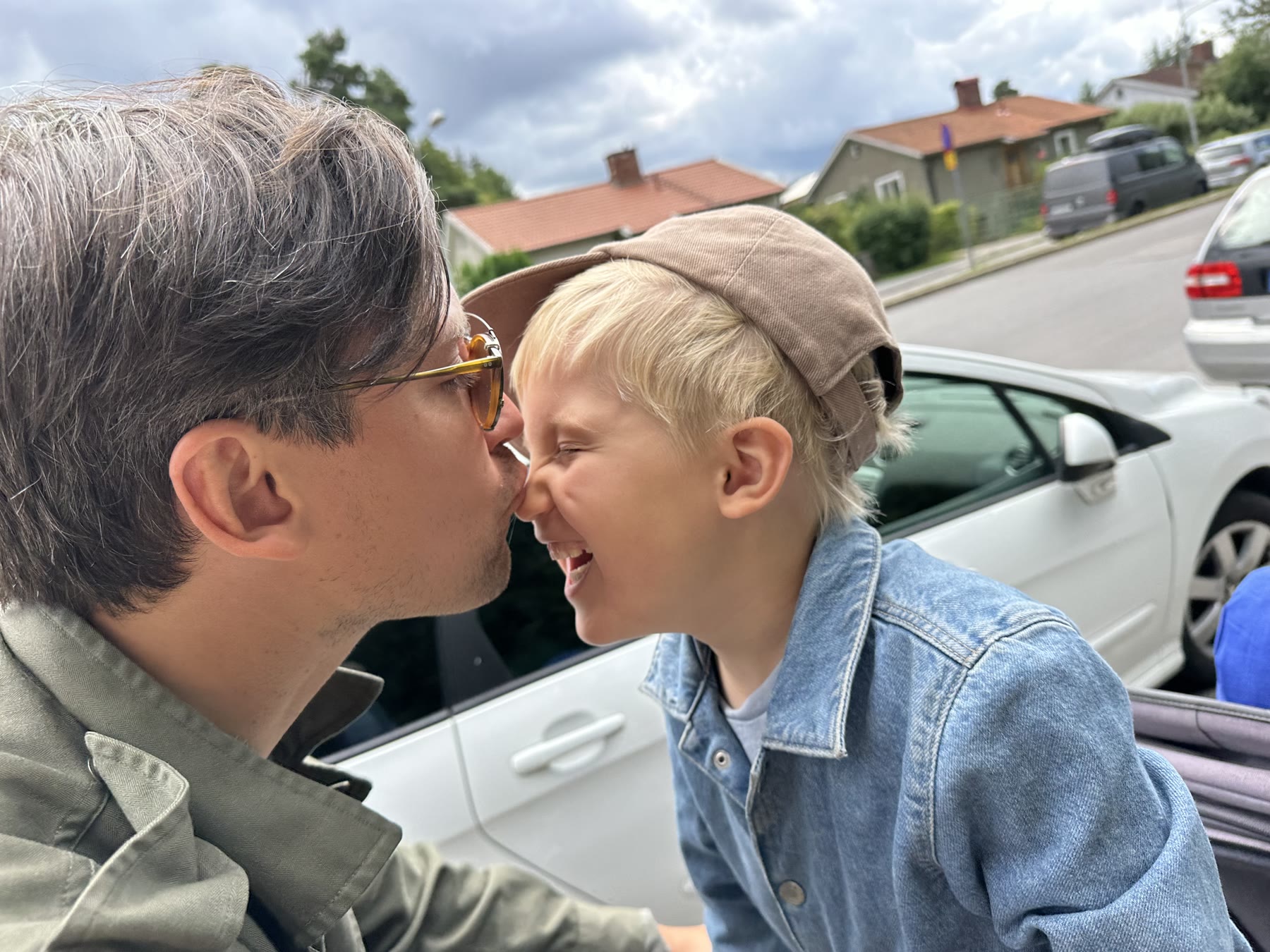 Mattias, founder of Tala, laughing nose-to-nose with his son Tom